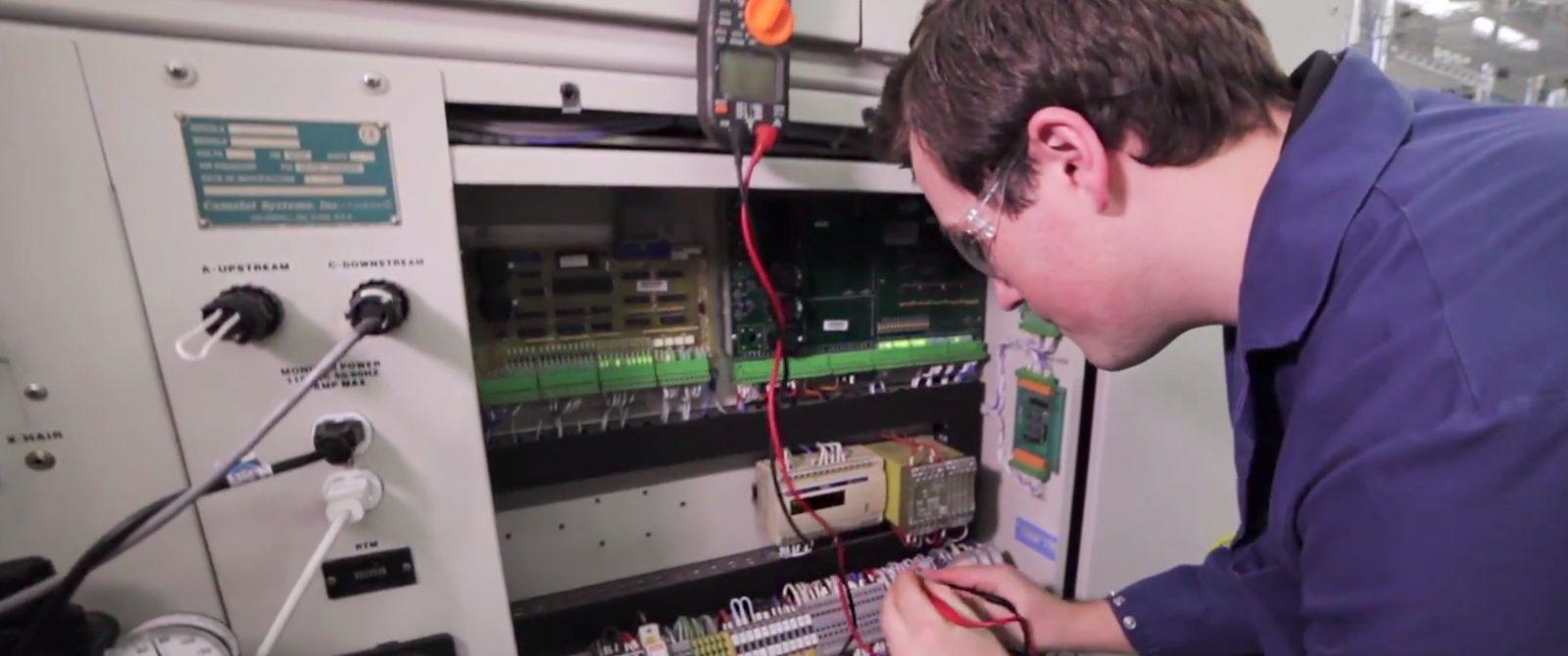 Photo of phlebotomy students using lab equipment