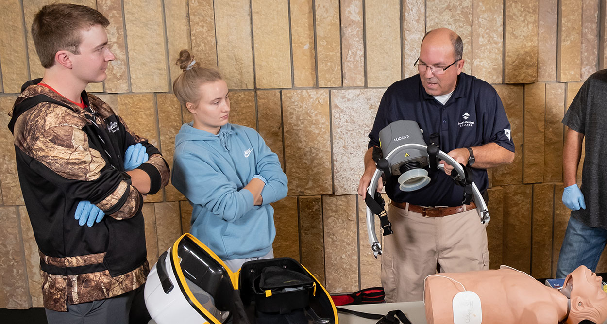 Photo of CWE instructor teaching medical training to students