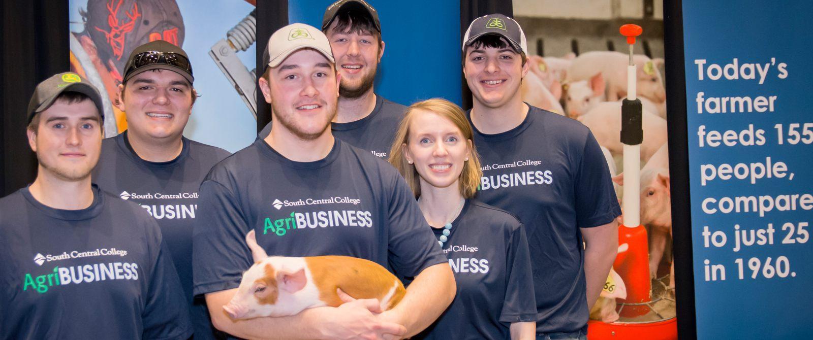 Photo of ag production students holding goats